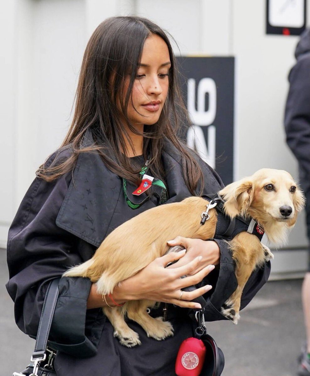 arexandra's tweet photo. Dark hair dances softly in the breeze while her little golden companion rests secure in her arms, two souls perfectly in tune. Tenderness wrapped in strength a beautiful harmony of fierce independence and quiet, unconditional love. https://t.co/h2aev5DxXy