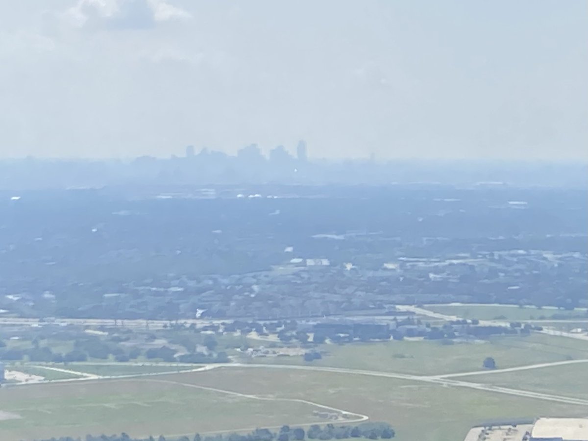 MeanMeosh's tweet photo. @TxStormChasers those lazy, crazy, hazy days of summer are a-comin’. View of downtown #dallas on takeoff from @DFWAirport #txwx #dfwwx https://t.co/Pq9OJxs5Je