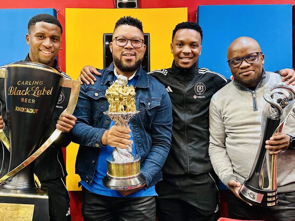 Themba_TT's tweet photo. Orlando Pirates players Mpho Tshabatsane and Boitumelo Radiopane alongside Orlando Pirates Media Officer Ms Thandi Merafe. They visited @jozifm on a trophy parade 🏆 🏆 🏆 

Amabhakaniya won the league title for the first time in fourteen years. Congratulations Champions 🫡 https://t.co/WpVjiAEuXI