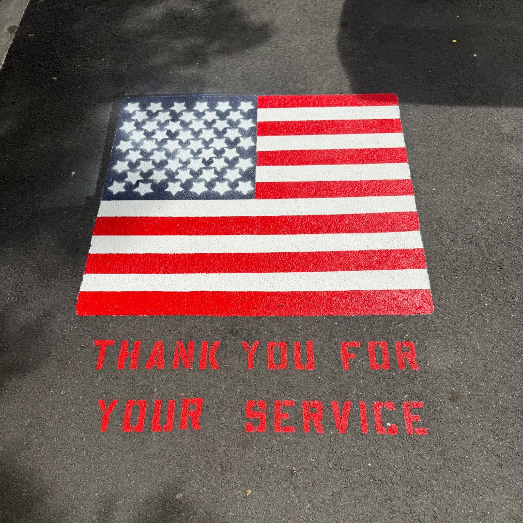 ChelseaGov_MA's tweet photo. This week, Cesar and Santos from our Chelsea Department of Public Works picked up their brushes and painted an American Flag on the City's dedicated veteran parking spot outside City Hall. https://t.co/un6X8c6XsX
