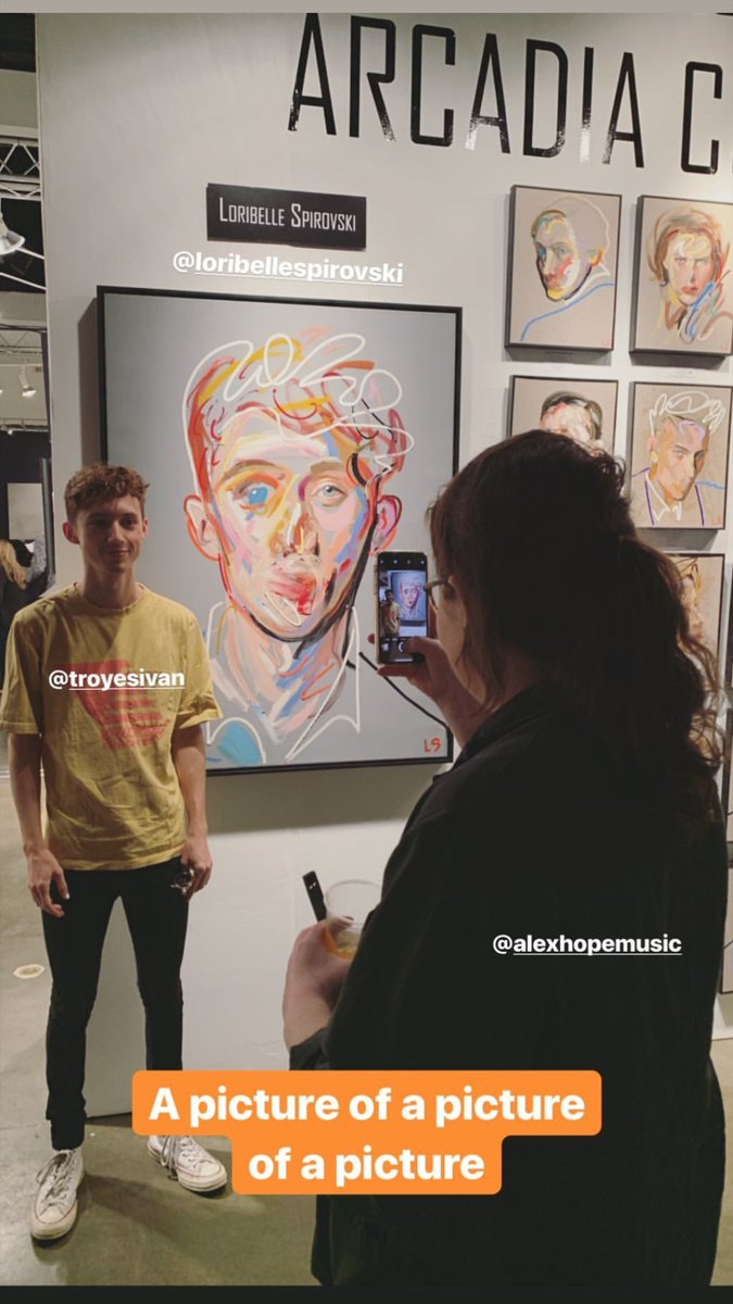 bluebloom97's tweet photo. troye sivan standing in front of paintings that look exactly like him is one of those genres it takes a long time to collect two of 📷 loribelle spirovski, alex hope https://t.co/YJrjIFgArQ
