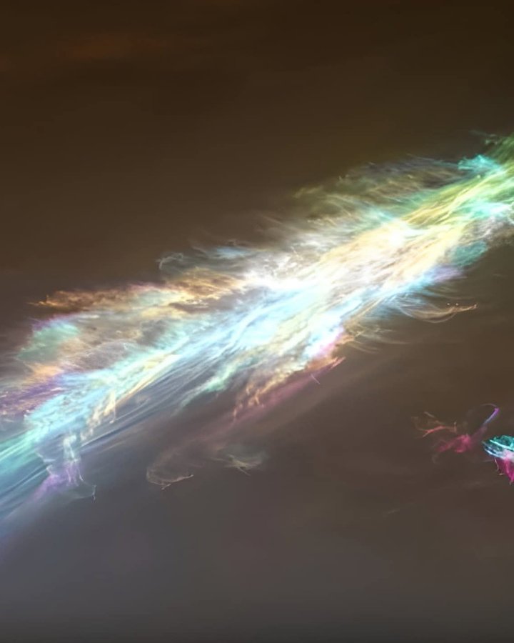 konstructivizm's tweet photo. NASA’s Curiosity rover has captured one of the most breathtaking sights on Mars: shimmering, iridescent “mother-of-pearl” clouds glowing high in the Martian twilight.These rare, feather-like clouds float at extreme altitudes of 37 to 50 miles (60 to 80 kilometers) above the surface — roughly twice as high as most commercial airplanes fly on Earth. Unlike the water-ice clouds we’re familiar with, these are made of frozen carbon dioxide, or dry ice, forming only in the planet’s frigid upper atmosphere where temperatures plunge far below freezing. 

How the Phenomenon HappensAs the Sun dips below the Martian horizon, the sky darkens for surface observers — but these high-altitude clouds remain bathed in sunlight. The tiny, uniform-sized dry ice crystals act like microscopic prisms. When sunlight hits them, it diffracts (bends and scatters), separating the light into vivid pastel and rainbow hues: soft pinks, greens, blues, and pearlescent whites.This is the same optical effect that creates Earth’s nacreous (mother-of-pearl) clouds in polar regions, but on Mars it’s even more striking because the atmosphere is so thin and the crystals are so perfectly sized. The result? Ethereal, glowing clouds that look almost alien against the rusty Martian landscape. 

Curiosity has now spotted these iridescent twilight clouds multiple times in recent years (including striking images from January 2025), giving scientists a front-row seat to dynamic processes in Mars’ upper atmosphere. These observations help researchers understand how carbon dioxide freezes at unexpected heights and how the thin Martian air behaves during the transition from day to night.A fleeting, colorful reminder that even on a cold, dusty world, the sky can still put on a spectacular show.