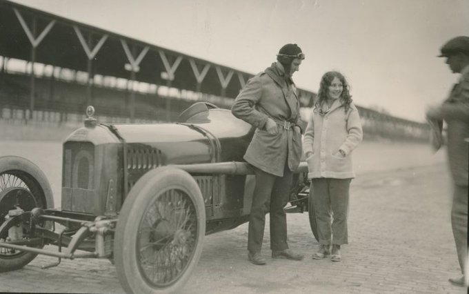 LiterateIndy's tweet photo. Finishing, as ever, with my favorite:

1919 #Indy500 winner Howdy Wilcox with intrepid Indianapolis Star reporter Mary Bostwick, the first woman to ride around the Speedway track at racing speed with a professional driver (Howdy) at the wheel.    

A quiet track. 

#ThisIsMay https://t.co/B5evhDgnJN