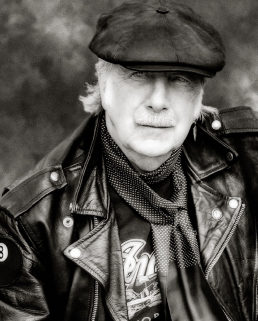 thethe's tweet photo. Deeply saddened to learn of the passing of our dear friend the legendary photographer John Claridge. A bon viveur and a kind, warm, funny and talented man, John was a customer of the Two Puddings back in the 1960s. He photographed us for 'The Comeback Special' tour and we also used a photo of his for the cover of our new book 'Cognitive Dissident'. Rest In Peace John. You are sincerely missed my friend.