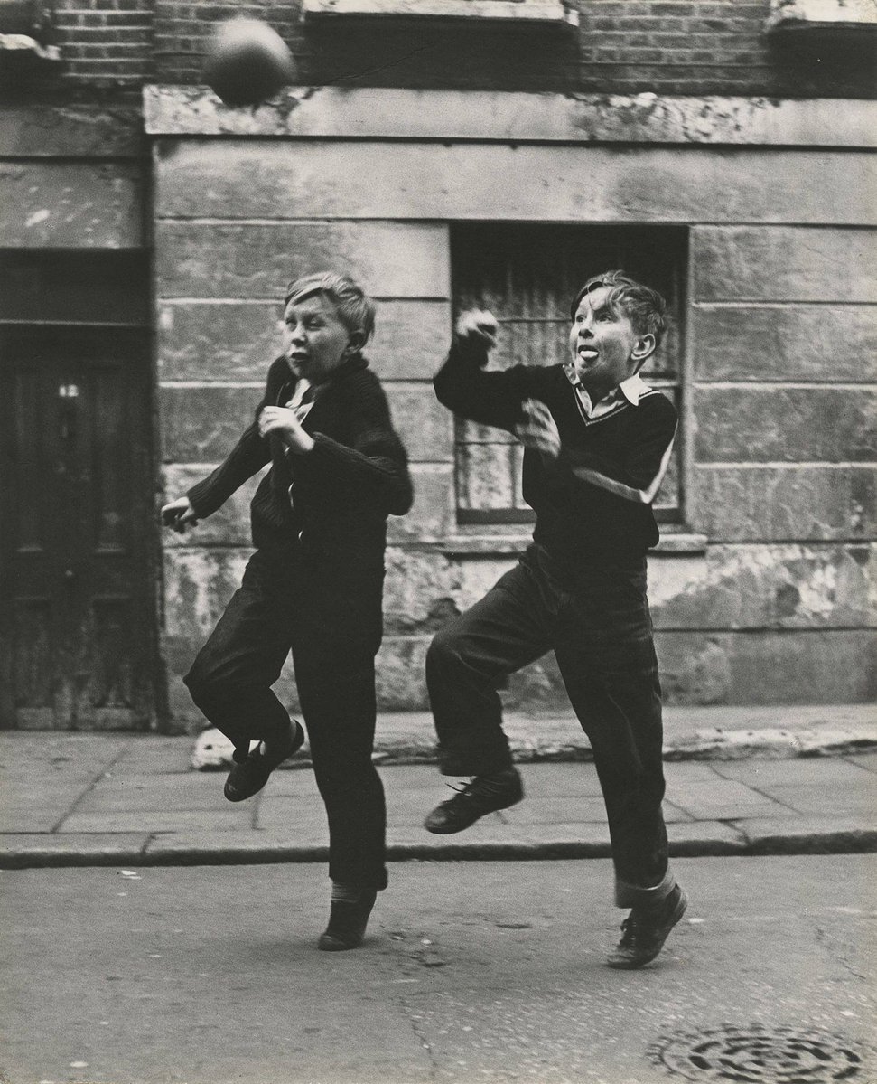 eyeonaxis's tweet photo. Football in the streets of London. England, 1950-60s, by Roger Mayne https://t.co/u4IjAddmv1