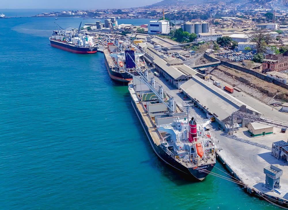 GleanerSierraLe's tweet photo. AGL pledges $60 million to modernise Freetown Port,  increase capacity, and create local jobs

Africa Global Logistics (AGL) has launched an ambitious $60 million modernisation program for Sierra Leone's Port of Freetown, aiming to reduce congestion, upgrade ageing infrastructure, and position the port as a competitive West African gateway. AGL has already deployed more than $5 million in modern equipment operated by trained Sierra Leonean personnel as part of a 2026 expansion plan, following a technical training program led by 11 Côte d'Ivoire experts. The larger investment includes more than $24 million in heavy cargo-handling equipment, including a $13.6 million ship-to-shore crane, two rubber-tyred gantry cranes ($6.5 million), and nine electric terminal tractors ($2.2 million), as well as forklifts, reach stackers, and empty handlers. About $25 million has been set aside for the rehabilitation of quays 3-6, with additional funds for a new administrative complex, documentation centre, expanded paved operational areas, and power infrastructure upgrades. AGL will also install nearly one megawatt of solar capacity to reduce energy costs and increase sustainability. The company prioritises local human capital development, with over 99% of its employees being Sierra Leoneans, and is funding community projects such as school expansion, scholarships, food aid, and agricultural programs to increase women's technical participation. The Port of Freetown, which covers more than 213,000 square metres, handles imports, exports, mining logistics, oil and gas, telecommunications equipment, and agricultural trade, and the upgrades are intended to increase throughput and attract more regional ship traffic.
#SierraLeone