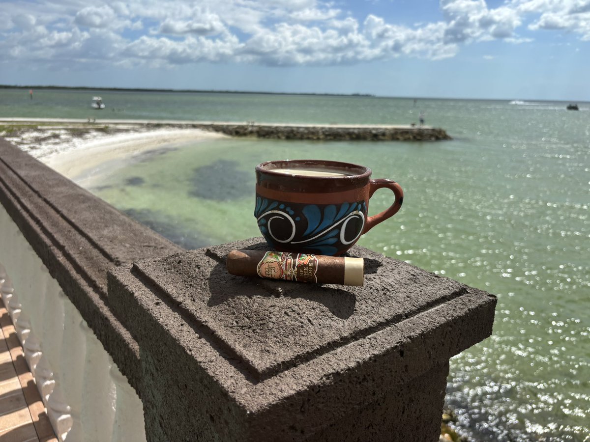 TheGrayLinePod's tweet photo. Buenos Dias Cigar and Boxing Aficionados. Enjoying a beautiful day in Apollo Beach. My favorite cigar My Family The Judge with my cafecito con leche. It doesn’t get better than this. https://t.co/0zRm5vebbc