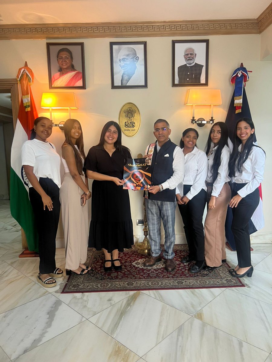 IndiainDR's tweet photo. El embajador KD Dewal recibió una visita de cortesía de un grupo de jóvenes que participan en el proyecto ShakthiSAT, dirigido por Alba Vásquez, fundadora de AstroQuisqueya.

Este programa, una iniciativa de la India respaldada por la ISRO, tiene como objetivo empoderar a las niñas de entre 14 y 19 años en habilidades STEM, formándolas en ciencia, tecnología y exploración espacial.

La India es conocida por sus importantes avances en el sector aeroespacial. A través de esta iniciativa, se seleccionará a una joven dominicana y se le dará la oportunidad de viajar a la India para ayudar a construir un satélite lunar, que será lanzado y puesto en órbita terrestre baja (LEO).
_____________________________________________________

Ambassador KD Dewal received a courtesy visit from a group of young girls involved in the ShakthiSAT project, an led by Alba Vásquez, founder of AstroQuisqueya.

This programme, an initiative from India, supported by ISRO, aims to empower young girls aged between 14 and 19 in STEM skills, training them in science, technology and space exploration. 

India is renowned for its significant advances in aerospace. Through this initiative, a young Dominican girl will be selected and given the opportunity to travel to India to help build a lunar satellite, which will be launched and put in LEO.

@MEAIndia @PIB_India @mygovindia  @isro @astroquisqueya #SPACEMEDIA #STEM