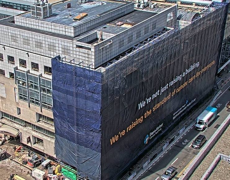 BIDMChealth's tweet photo. We’re seeing exciting progress on the @danafarber BIDMC Collaboration! A wrap has gone up on the site of Dana-Farber’s Future Cancer Hospital that reads, "We're not just raising a building. We're raising the standard of cancer care for everyone." https://t.co/OfELoEdsvh