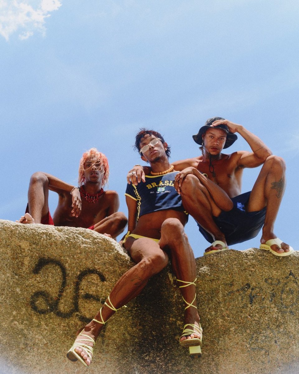 vsco's tweet photo. @rodyoli is a film photographer from Brazil whose work captures the beauty and intimacy of life in Rio de Janeiro. This image of Jhonny, Cesanne, and Gaels celebrating queer visibility and joy in the streets of Rio is part of our @photoville exhibition, Portraits of Proximity. https://t.co/PN2T1n1Tgf