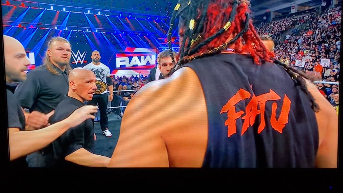 DaveKich's tweet photo. The OTC and Jacob Fatu sign the contract for Tribal Combat on @WWE Monday Night RAW @TheSchott!

#WWERaw https://t.co/QACHjdojhM