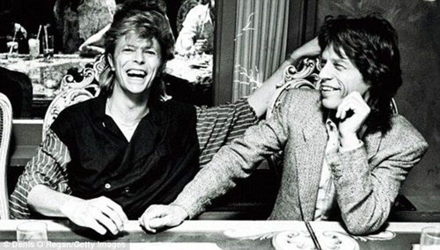 crockpics's tweet photo. David Bowie and Mick Jagger sharing a laugh at the China Club in New York City, September 1983. Official tour photographer Denis O'Regan caught this fantastic candid moment at an afterparty during the Serious Moonlight tour. What is your favorite track from either of them during the 80s?