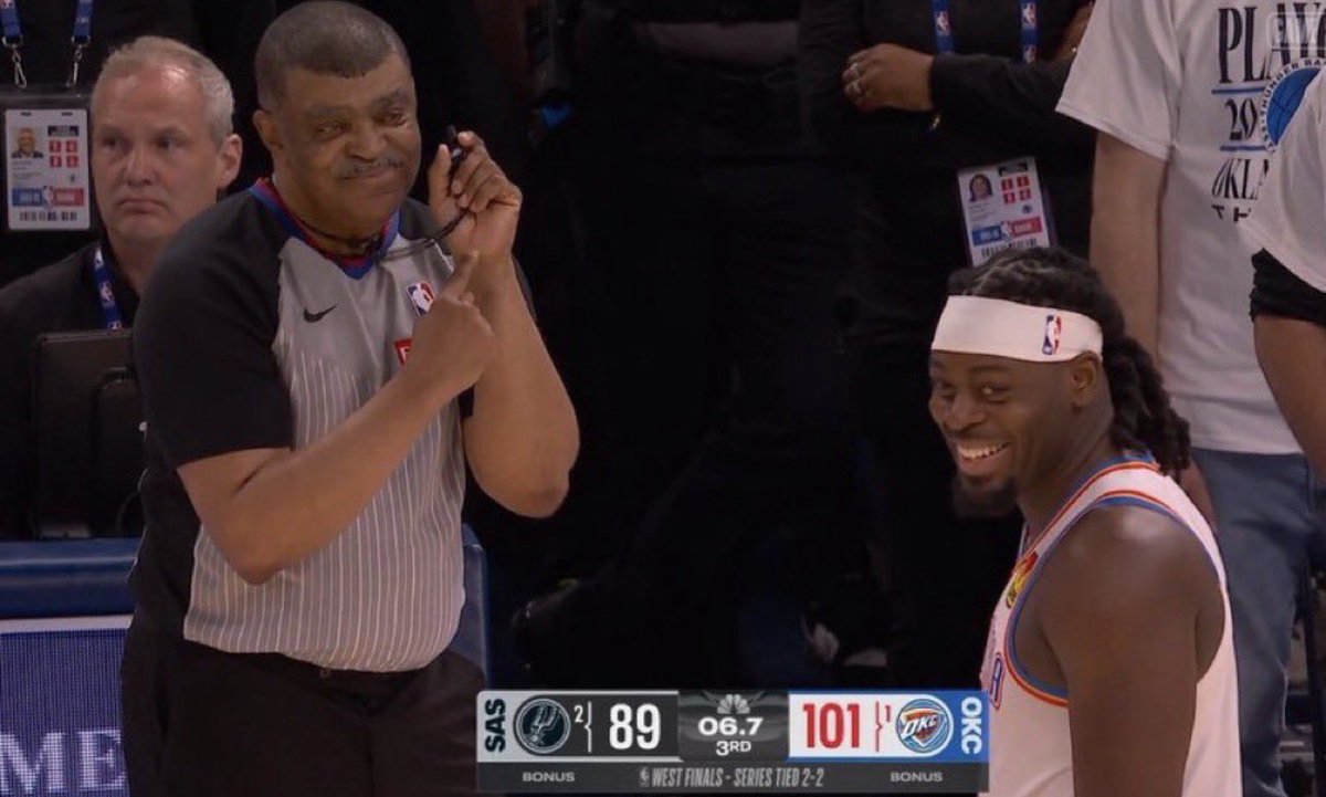 RashticReport's tweet photo. Dawg. This can’t be real Lu Dort and Tony Brothers laughing on the sideline during the OKC Thunder vs San Antonio Spurs Game 5… bro is smiling like a high school girl looking at her crush LMAOO 😭 https://t.co/bz14sMpufn