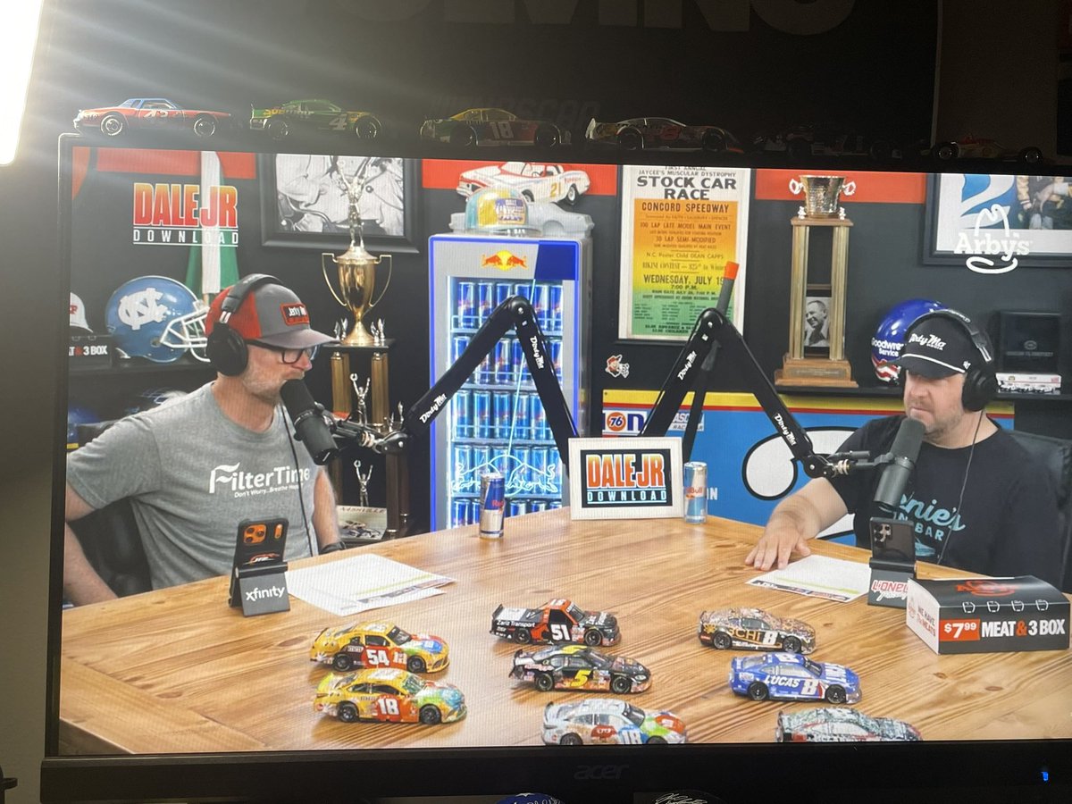 MattThomerson's tweet photo. Touching gesture by Dale Earnhardt Jr. &amp; the @DirtyMoMedia crowd as they switched all the diecast on their podcast table to Kyle Busch diecast.

#NASCAR https://t.co/fGmiuaWLMO
