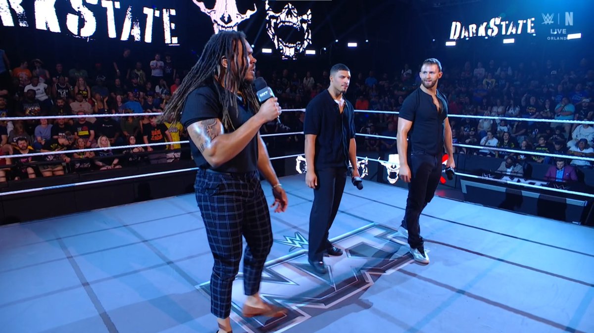 WrestleTalk_TV's tweet photo. DarkState say that Saquon Shugars was always the odd man out, because he was an independent wrestler while they are all elite level athletes

"There's a reason he was the last picked for DarkState" https://t.co/n6LgAnxFCC