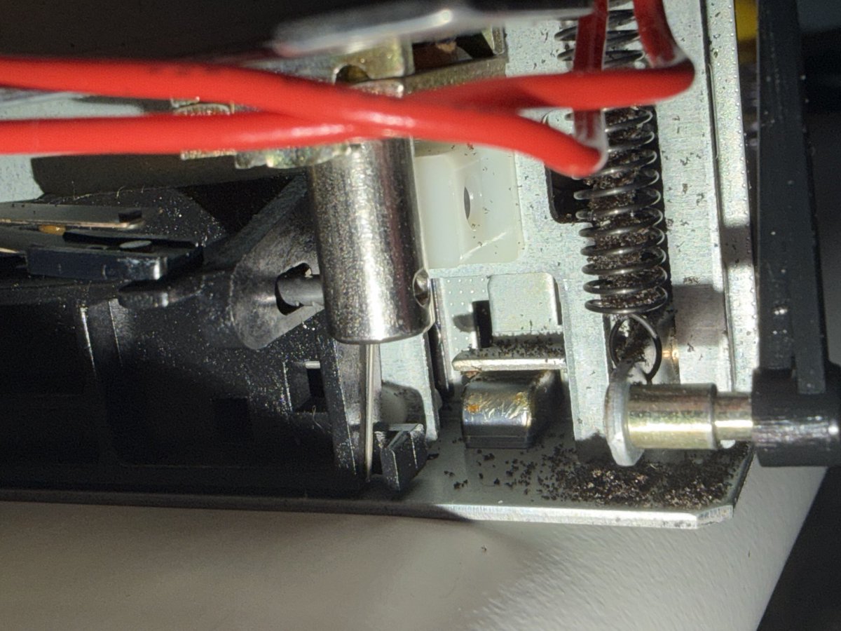 DisplacedGamers's tweet photo. Ok. Back at it after a week away. 

Belt 3 of 3 in place for tape counter. 
The ejection dampening cylinder… thing fell out while working on it a couple of weeks ago. Had to unscrew the mech and get it back into place without the belts slipping off the pulleys. Whew. https://t.co/dT0cAO9UEF