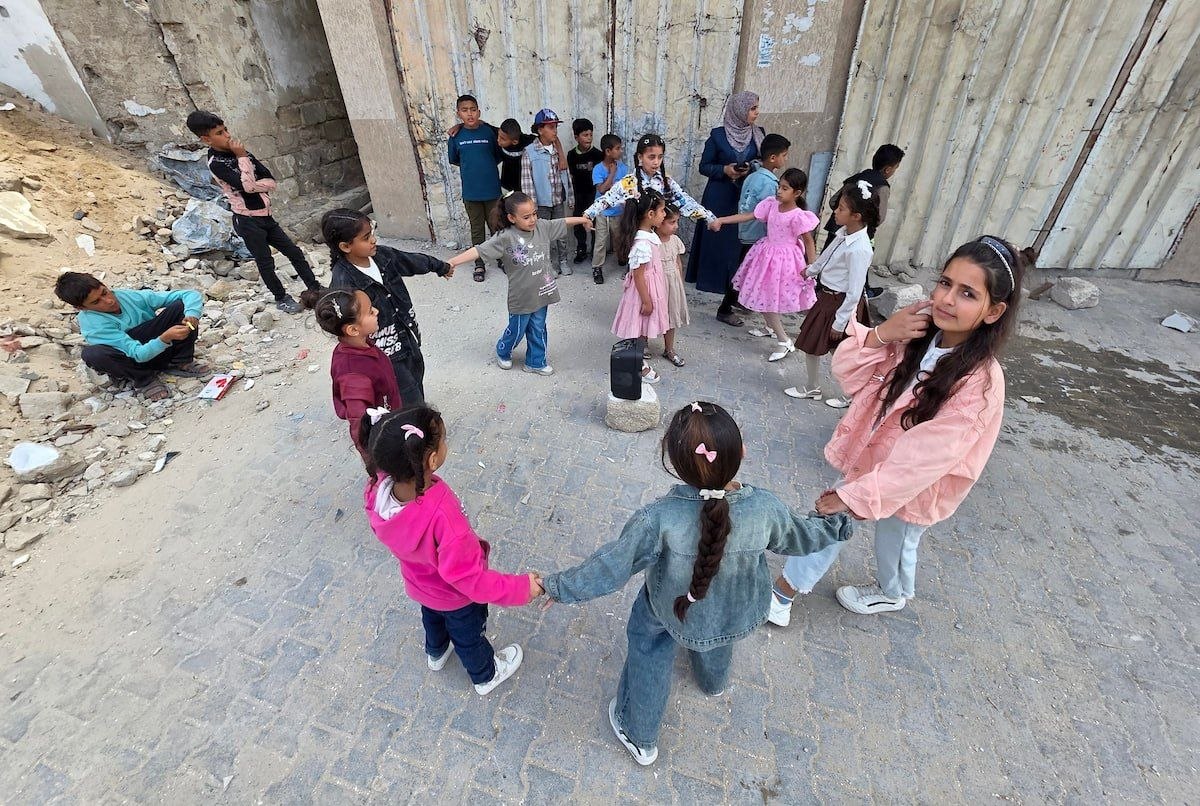 QudsNen's tweet photo. Palestinian children in the Gaza Strip celebrate Eid Al-Adha amid the rubble of homes destroyed by Israel during the ongoing genocide. https://t.co/EUKjw5jBwQ