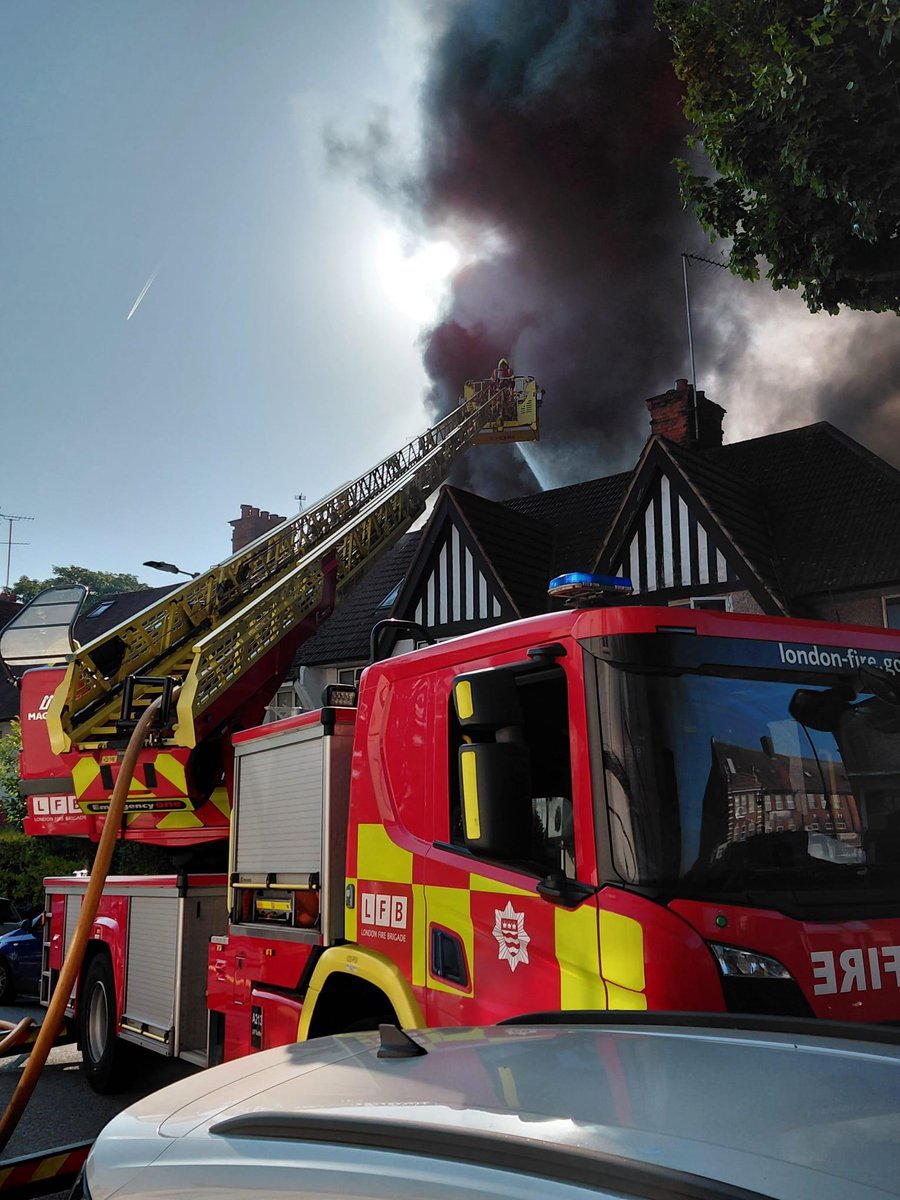 LondonFire's tweet photo. Firefighters are working hard to bring this fire under control. 

A turntable ladder is being used to spray water on the fire from above a neighbouring building.

Our Drone Team are also on scene to survey the incident from above, providing live images and thermal imagery. https://t.co/mQcrBScnYj