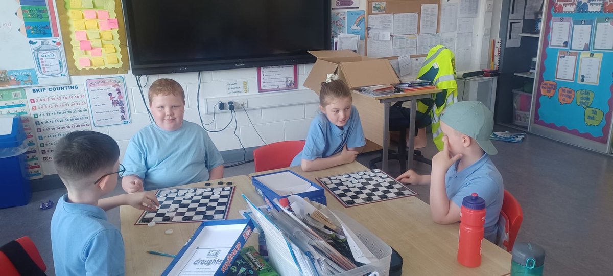 HolyJuni1's tweet photo. Ms Ryan was teaching Ms Gallagher’s 2nd class to play draughts today! https://t.co/iC3MymlLhS