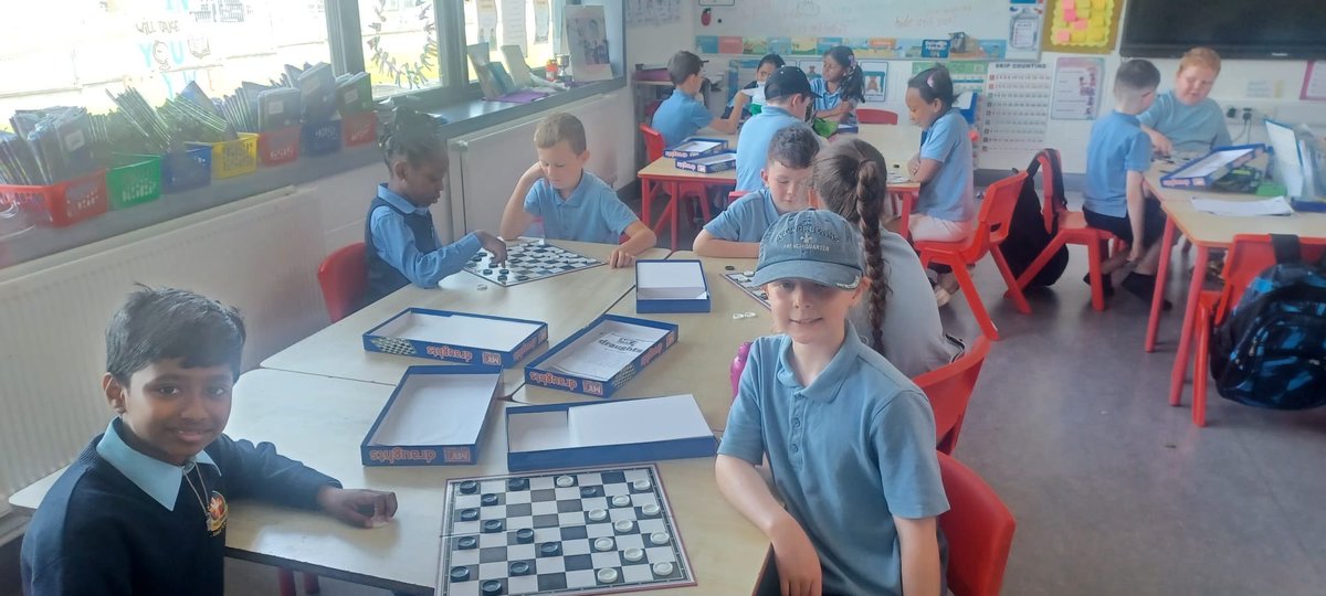 HolyJuni1's tweet photo. Ms Ryan was teaching Ms Gallagher’s 2nd class to play draughts today! https://t.co/iC3MymlLhS