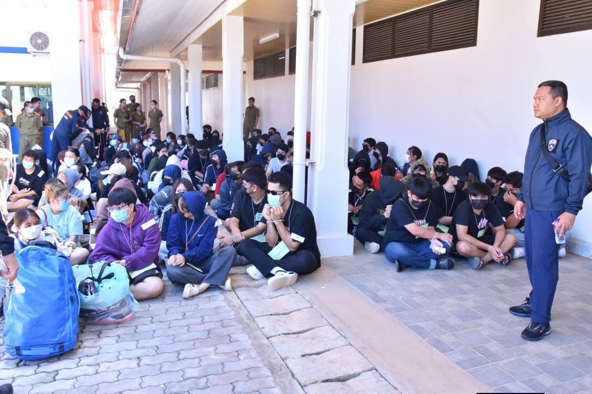 jacobincambodia's tweet photo. Laos Sent 106 Thai Scammers Back Across the New Bueng Kan Bridge. The Front Was a Government Lottery Company.

Lao authorities handed over 106 Thai nationals at the Bueng Kan border today, from a May 19 raid in Paksan district that hit five buildings. Among them, the TF-LVE Lao Government Lottery Company, a firm Lao police say was legally registered but using its half-built lottery business as a front for an online gambling operation serving Thailand, Vietnam, China, and Malaysia. Slots, baccarat, football betting, lottery games.

The seizure numbers are unusual. 164 desktops, 149 laptops, 21 additional computers, 119 phones, 3 printers. That's more than three machines per worker. 51 of the 106 are women. Most said they answered Facebook ads for admin, customer-chat, and video editing jobs paying 35,000 baht a month. They entered Laos as tourists.

Bueng Kan immigration is now running all 106 through National Referral Mechanism screening to separate trafficking victims from willing employees. Nine have prior arrests. One has more than 70 outstanding mule-account warrants. Eleven others are flagged for further mule-account questioning.