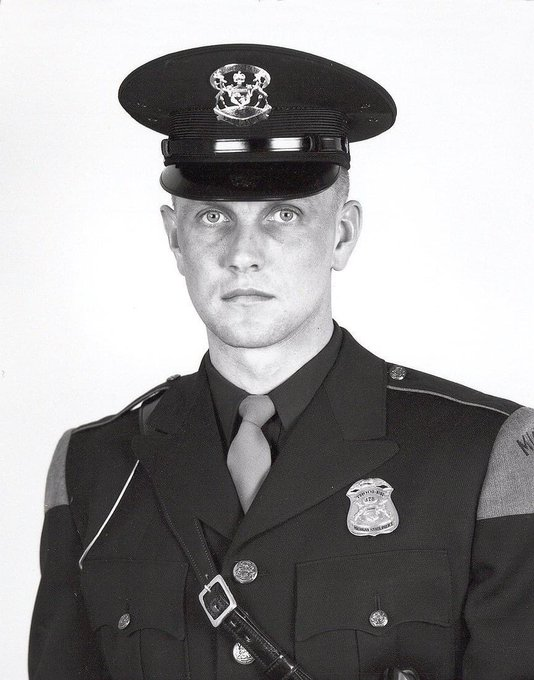MSPFirstDist's tweet photo. 🇺🇸We Will Never Forget. In memory of our fallen trooper who made the ultimate sacrifice on this day in 1974. 

Tpr Darryl M. Rantanen
November 12, 1937-May 27, 1974

Tpr. Darryl M. Rantanen was killed in a traffic accident while involved in the chase of a stolen automobile. 

Trooper Rantanen and his partner were pursuing a stolen car occupied by two youths, after being alerted by Escanaba police. 

Trooper Rantanen’s partner, the driver of the patrol car, attempted to pull alongside the stolen car. Before the patrol car could be brought alongside the fleeing vehicle, the driver swerved across the centerline forcing the patrol unit off the roadway. Both vehicles left the roadway with the patrol unit turning on to its side and its top striking a tree. The stolen car skidded back across the roadway and came to rest in the ditch on the opposite side. The occupants then fled. 

Trooper Rantanen was pronounced dead at a local hospital. His partner, seriously injured, remained under hospital and medical care for six months. The driver of the stolen car, later apprehended, was convicted in Delta County Circuit Court and was sentenced to terms of 4-1/2 to 15 years for involuntary manslaughter and 4-1/2 to 10 years for intent to do great bodily harm to the other officer.  

Trooper Rantanen was the 29th MSP officer to die in the line of duty.