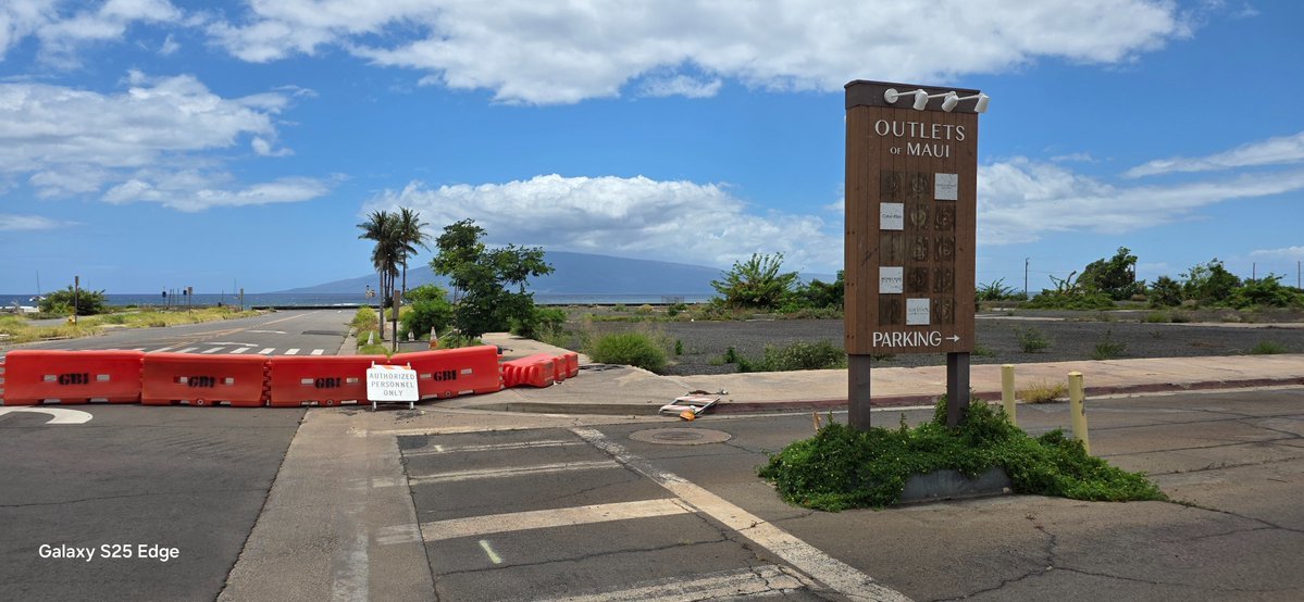 GreatBasinPower's tweet photo. 𝗦𝗼𝗺𝗲𝘁𝗵𝗶𝗻𝗴 𝗙𝗲𝗲𝗹𝘀 𝗢𝗳𝗳 𝗜𝗻 𝗠𝗮𝘂𝗶

Yesterday, I visited what remains of Old Town Lahaina, my first in-person look since the 2023 fire, and what I found struck me sideways, backwards, upside down, and inside out. A once vibrant village simply vanished as though the fire gods themselves remorselessly targeted Maui's heart and soul, transforming the island's feel into a place that might as well be the mainland.

Crumbling walkways, pier supports without piers, hollowed-out concrete structures, US Army Corp of Engineers signs, and "government property no trespassing” warnings supplant seaside restaurants, cobblestone walkways, catamaran snorkel sail, bustling shopping, and barefeet works everywhere good vibes; transforming the area into a desolate and empty shell increasingly hidden by weeds sprouting through walkway and parking lot cracks - erasing bit by bit evidence such a magical place ever existed.

Lack of restoration stuns the senses. I see no effort being made to rebuild the area save a few  apartment structures outside the perimeter of Old Lahaina. No contractors anywhere. No people except one woman who appears to own one of the shelled out buildings, sitting inside a plastic storage shed doing nothing. Three or four tourists walk around Lahaina's famed but now fenced off banyan tree, miraculously spared from the firegod's wrath. Foodland Grocery chose to rebuild outside the district rather than wait upon whatever it is being waited. Outlet stores seem to have chosen nothing rather than rebuild elsewhere.  Some enterprises, like Dukes, relocated to sprawling golf/condo Kaanapali. Otherwise, nothing.

A bypass highway skirts visitors and residents around downtown and, for those who never visited Maui pre-fire, nothing strikes them out of the ordinary. Highway speeds, impatient drivers,  near constant traffic, and small strip malls give the place a mainland feel - contradicting directly what made it uniquely special to those of us fortunate enough to visit the island in the 80s, 90s, and early 2000s. Almost immediately upon exiting Kahului Airport a giant Walmart, Target, and Home Depot retail area greets visitors.  Several random homeless people hint at a larger, hidden population which I find accidentally later, including one sizable contingent outside Paia lining a decaying road not far from architecturally profound Old Maui Highschool. 

At a distance, Maui appears the same beautiful place I fell in love with years ago. Up close, it feels increasingly like an aging oceanside, socio-economic segregated area almost akin to some areas of California except, unlike like Laguna Beach, Medicino, or even old town Napa, it lacks the unique heartbeat only old town areas can bring to a community. And, for myself, that's the problem. Maui doesn't feel like a community because what made its heartbeat beat sits idle, lifeless, seemingly forgotten. 

I don't live there nor do I own Lahaina property; therefore, I lack insight about local dynamics but of one thing I'm quite sure: something isn't right. It's plain as day. And it ruined my desire to revisit.

More photos at https://t.co/NcFoqWeoR5