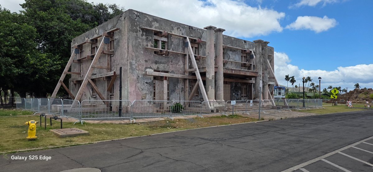 GreatBasinPower's tweet photo. 𝗦𝗼𝗺𝗲𝘁𝗵𝗶𝗻𝗴 𝗙𝗲𝗲𝗹𝘀 𝗢𝗳𝗳 𝗜𝗻 𝗠𝗮𝘂𝗶

Yesterday, I visited what remains of Old Town Lahaina, my first in-person look since the 2023 fire, and what I found struck me sideways, backwards, upside down, and inside out. A once vibrant village simply vanished as though the fire gods themselves remorselessly targeted Maui's heart and soul, transforming the island's feel into a place that might as well be the mainland.

Crumbling walkways, pier supports without piers, hollowed-out concrete structures, US Army Corp of Engineers signs, and "government property no trespassing” warnings supplant seaside restaurants, cobblestone walkways, catamaran snorkel sail, bustling shopping, and barefeet works everywhere good vibes; transforming the area into a desolate and empty shell increasingly hidden by weeds sprouting through walkway and parking lot cracks - erasing bit by bit evidence such a magical place ever existed.

Lack of restoration stuns the senses. I see no effort being made to rebuild the area save a few  apartment structures outside the perimeter of Old Lahaina. No contractors anywhere. No people except one woman who appears to own one of the shelled out buildings, sitting inside a plastic storage shed doing nothing. Three or four tourists walk around Lahaina's famed but now fenced off banyan tree, miraculously spared from the firegod's wrath. Foodland Grocery chose to rebuild outside the district rather than wait upon whatever it is being waited. Outlet stores seem to have chosen nothing rather than rebuild elsewhere.  Some enterprises, like Dukes, relocated to sprawling golf/condo Kaanapali. Otherwise, nothing.

A bypass highway skirts visitors and residents around downtown and, for those who never visited Maui pre-fire, nothing strikes them out of the ordinary. Highway speeds, impatient drivers,  near constant traffic, and small strip malls give the place a mainland feel - contradicting directly what made it uniquely special to those of us fortunate enough to visit the island in the 80s, 90s, and early 2000s. Almost immediately upon exiting Kahului Airport a giant Walmart, Target, and Home Depot retail area greets visitors.  Several random homeless people hint at a larger, hidden population which I find accidentally later, including one sizable contingent outside Paia lining a decaying road not far from architecturally profound Old Maui Highschool. 

At a distance, Maui appears the same beautiful place I fell in love with years ago. Up close, it feels increasingly like an aging oceanside, socio-economic segregated area almost akin to some areas of California except, unlike like Laguna Beach, Medicino, or even old town Napa, it lacks the unique heartbeat only old town areas can bring to a community. And, for myself, that's the problem. Maui doesn't feel like a community because what made its heartbeat beat sits idle, lifeless, seemingly forgotten. 

I don't live there nor do I own Lahaina property; therefore, I lack insight about local dynamics but of one thing I'm quite sure: something isn't right. It's plain as day. And it ruined my desire to revisit.

More photos at https://t.co/NcFoqWeoR5