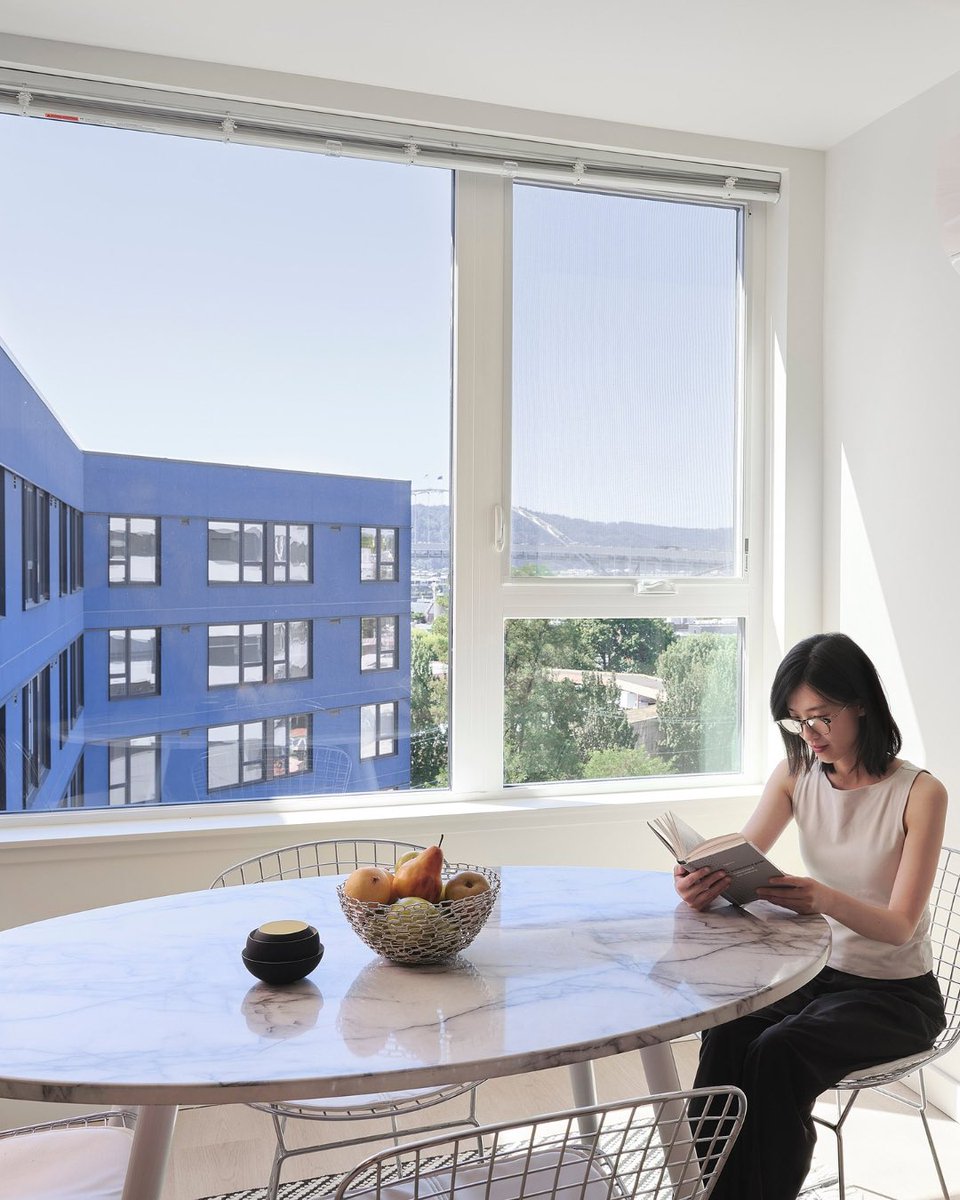 LEVERARC's tweet photo. Designed by LEVER, Albina One is a 94-unit affordable housing project in Portland, Oregon. The building includes courtyards, communal spaces, a large park, and west-facing double-height terraces within a deep blue façade accented by gold screens https://t.co/mwCS9qa670