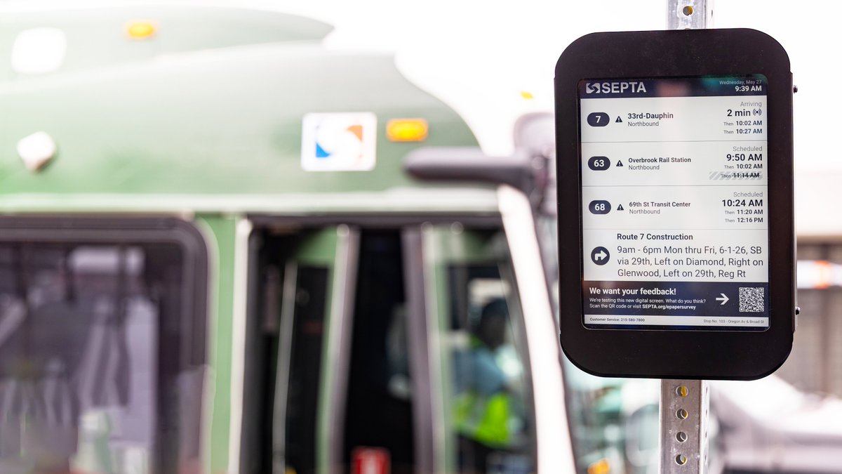 SEPTAPHILLY's tweet photo. Today #SEPTA deployed its first digital real-time arrival display at a bus stop in South Philadelphia as part of a pilot program to bring more real-time information to riders. 🥳

SEPTA installed the first device at the northeast corner of Broad St & Oregon Av which serves Bus Routes 7, 63, and 68. Nine more devices are coming to Bus stops as well as T, G, D, and M stops/stations across the system:

• 40th St Trolley Portal (T2, T3, T4 & T5)
• Schuylkill Av & JFK Blvd (9, 44, 62, 124 & 125)
• Stadium Station (M1)
• Girard Av & Broad St (G1)
• Girard Av & Front St (5 & G1)
• City Av & Presidential Blvd (1, 44 & 65)
• Drexel Hill Junction Station (D1 & D2)
• 52nd St & Market St (52)
• Allegheny Av & Kensington Av (60)

Pilot locations were selected based on two key criteria: overall customer impact and geographic equity.

The screens are solar-powered, use e-paper technology, and are unique because they are small enough to be mounted on a bus stop sign pole. Each device is equipped with a text-to-speech button which gives blind and low-vision riders access to the same real-time service information.

Knowing when the next vehicle will arrive was a top priority for many of the 20,000 riders who participated in the comprehensive community engagement efforts for our New Bus Network.

#ISEPTAPHILLY