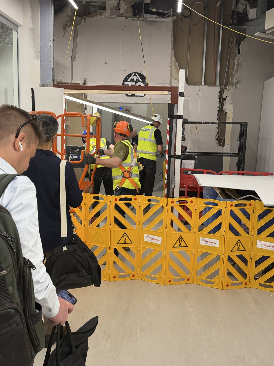 barrykd's tweet photo. @DublinAirport - this is our view and roadblock going from T1 to T2. A great construction safety example. At least the guys had a good laugh. Do better. https://t.co/QkhWs6Xqdu