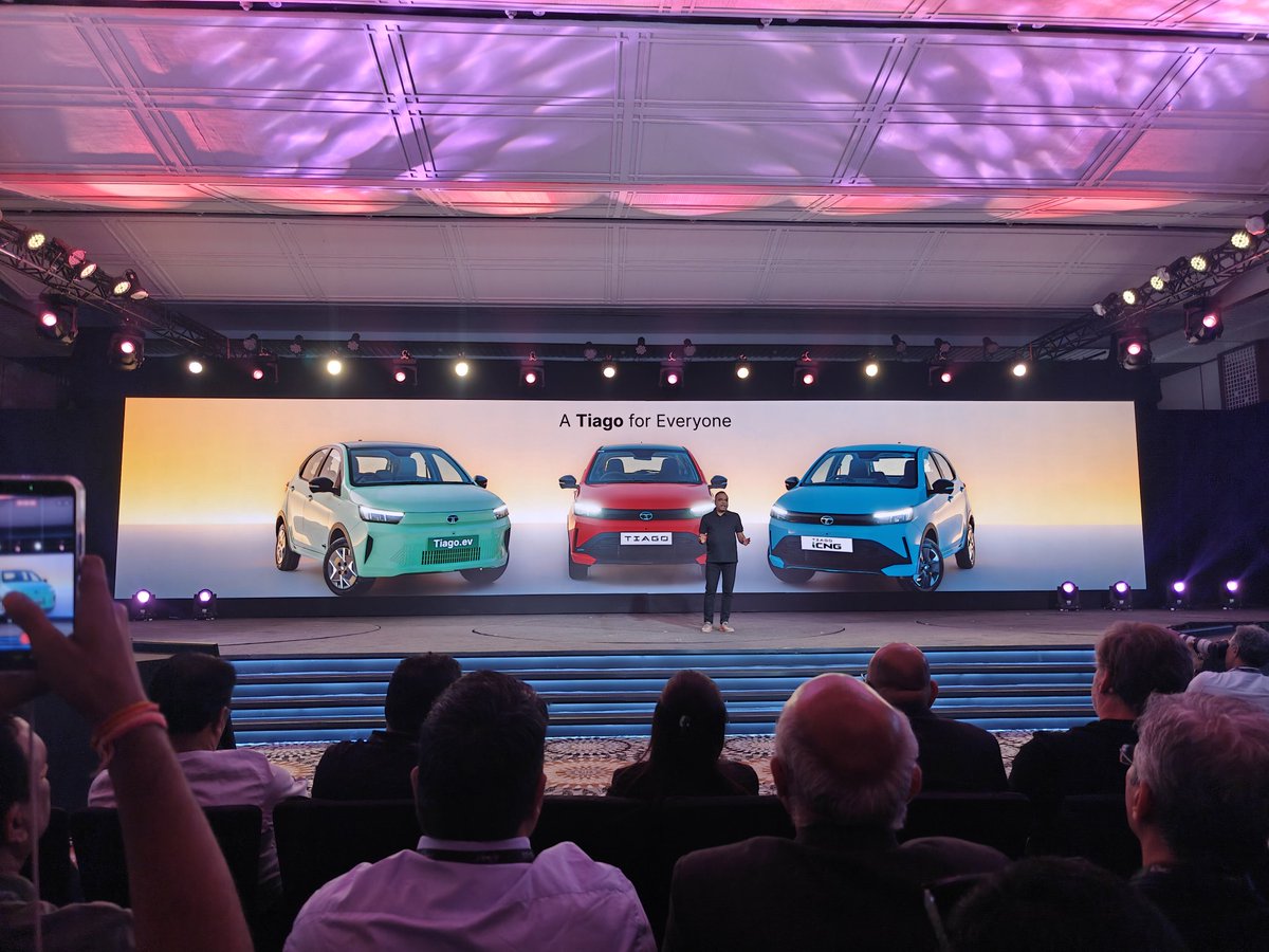 VahanWarta's tweet photo. The next-gen Tiago is clearly aiming to redefine what buyers should expect from an entry hatchback ⚡

✨ Modern silhouette
✨ Fabricia Luxe dashboard
✨ Connected tail lamps
✨ Premium layered interior design

But Tata didn’t stop at just looks 

✅ 360° Camera
✅ Blind View Monitor
✅ Auto-fold ORVMs
✅ Rear AC vents
✅ Wireless charging
✅ ESP with Traction Control
✅ 6 Airbags as standard

And the biggest highlight?
Tata is building an entire Tiago family now:

⚡ Tiago.ev
⛽ Tiago Petrol
🌱 Tiago iCNG

“A Tiago for Everyone” perfectly sums up the strategy 🎯

This no longer feels like just a budget hatchback. Tata seems to be positioning the Tiago as a small car with a much bigger-car experience 👀

#TataTiago #TheNextGenTiago #JustWOW #Tiago2026