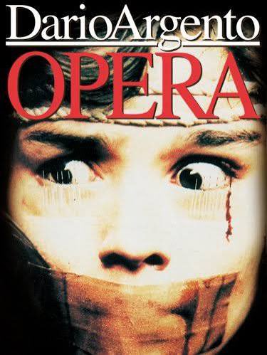 horror_80s's tweet photo. The iconic “needles taped under the eyes” in Dario Argento’s OPERA originated from his dismay at audience members closing their eyes during gore scenes in his films. He quipped about forcing them to watch, and it became a key element in the film. https://t.co/WOFFzM5bM6