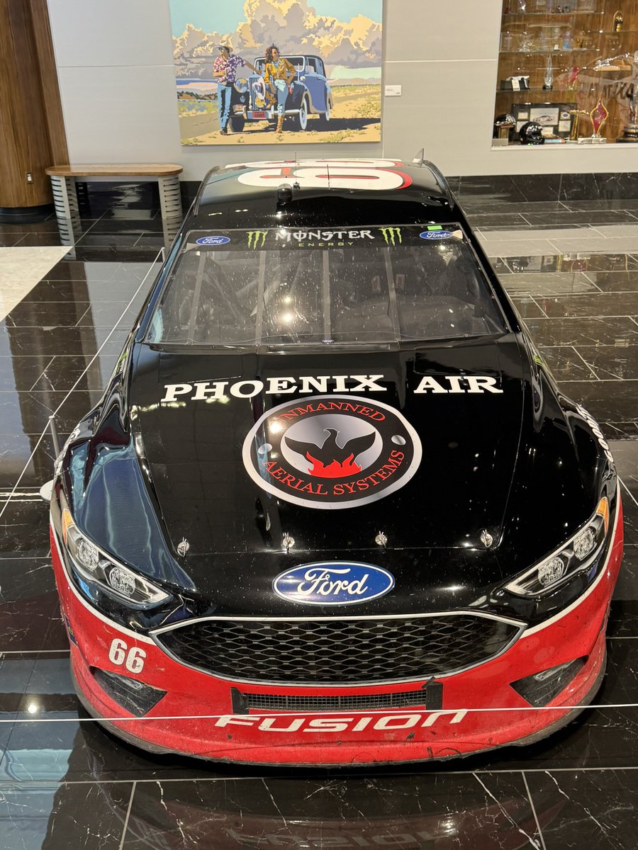 charliewh912's tweet photo. One of the more unique cars I’ve seen on display, Mark Thompson’s 22nd place finisher from the 2018 Daytona 500 for MBM. Mark is from Cartersville, GA, where the Savoya Museum is, and donated the car to their collection. Love the scrape down the side. 

CC: @LASTCARonBROCK https://t.co/wceMTu75Zp