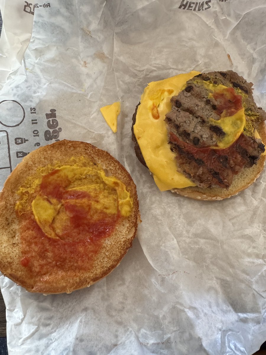 TroyLR's tweet photo. @BurgerKing why do I have a half eaten patty on my burger? https://t.co/7TcTaRDs7r