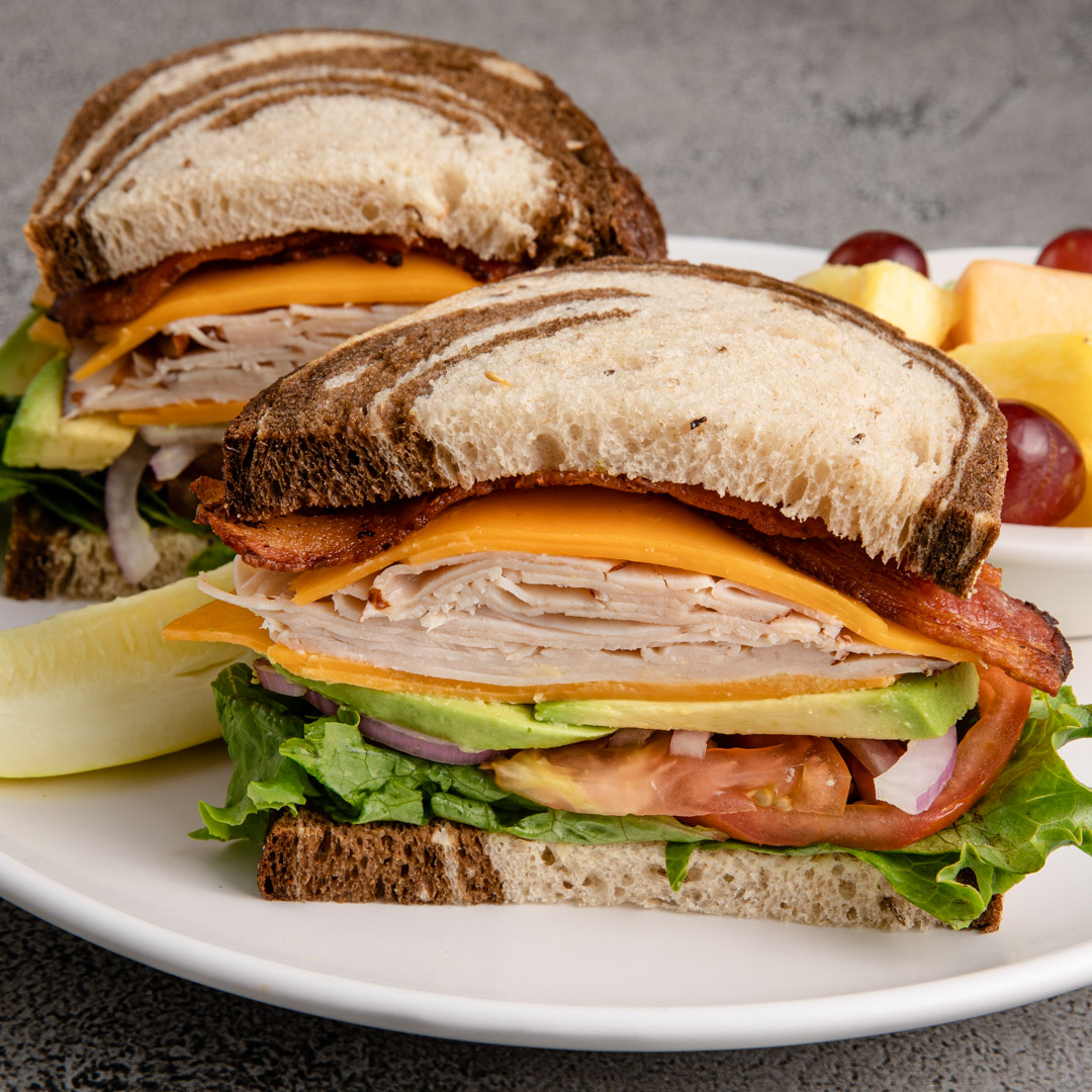 miraclemiledeli's tweet photo. Miracle Mile Deli has been serving up award-winning sandwiches for 77 years in the Valley of the Sun! Stop by and dive into our Turkacado Sandwich featuring white meat turkey breast, crispy bacon, smoky cheddar and avocado on a fresh baked bread or roll of your choice. https://t.co/Ttj24T91RN