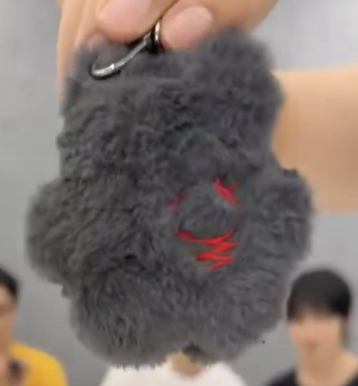 tearyloved's tweet photo. little details about onf’s new plushie

- name: fog
- its face is made of the letters “O N F”
- hearts and the color red are one of the main themes of this album so it has a huge red heart in the middle 
- the tail is lightbulb-shaped https://t.co/DSCooYrJZd