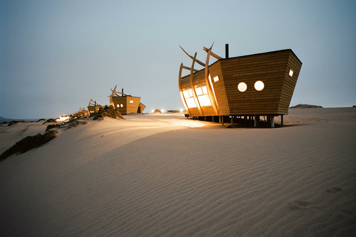 hallaboutafrica's tweet photo. Castaway architecture. To give visitors to Namibia's Skeleton Coast a place to stay in that isolated place where desert meets sea and hidden sandbars and dangerous currents have caused hundreds of shipwrecks to leave their rusting hulls on the beaches, the Shipwreck Lodge was designed thematically.