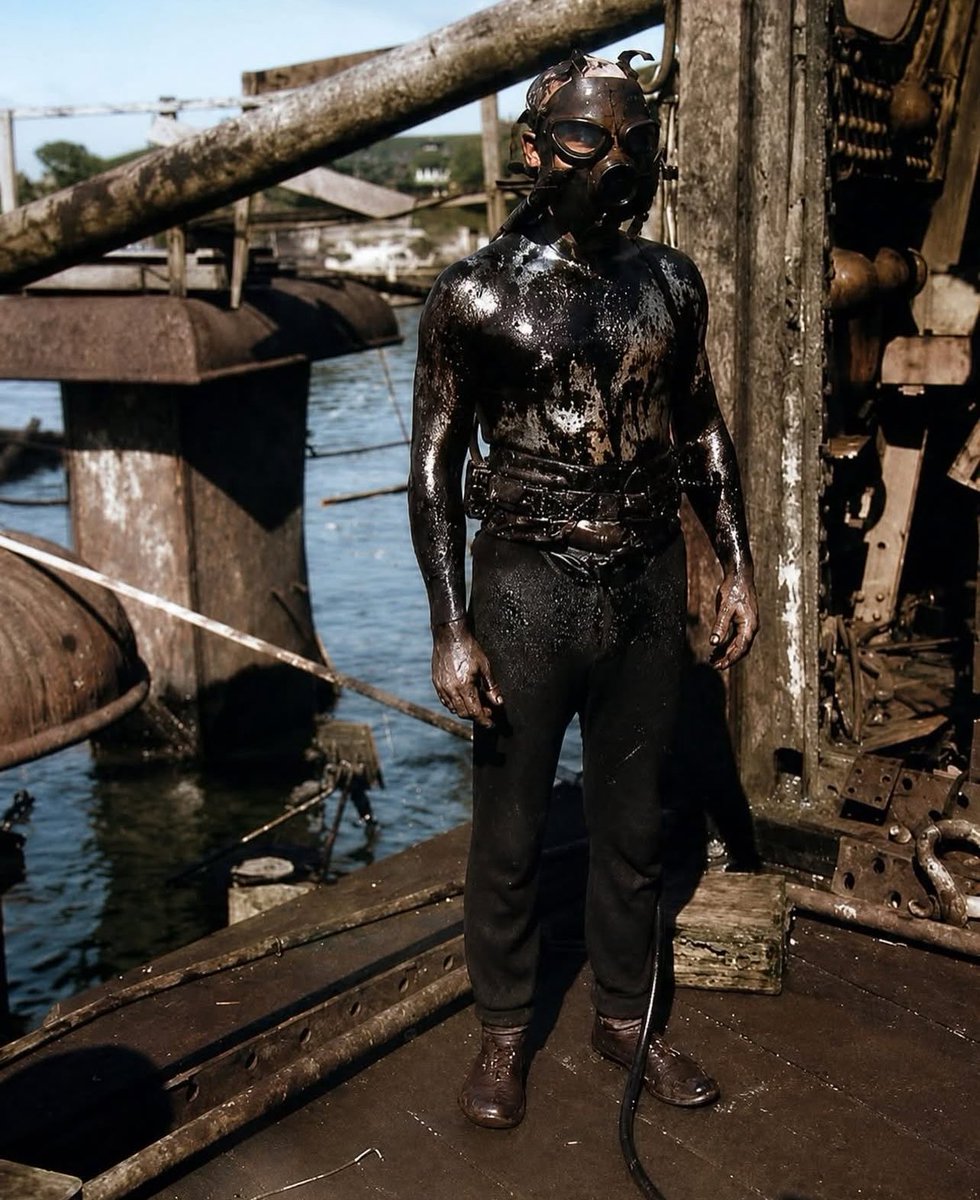 MilitaryCooI's tweet photo. A U.S. Navy diver emerges from the oil-slicked interior of the sunken battleship USS Arizona (BB-39).

Released on May 23, 1943, the photograph shows one of many risky dives during salvage and recovery work at Pearl Harbor after the Japanese attack on December 7, 1941. https://t.co/6nRzf7872x