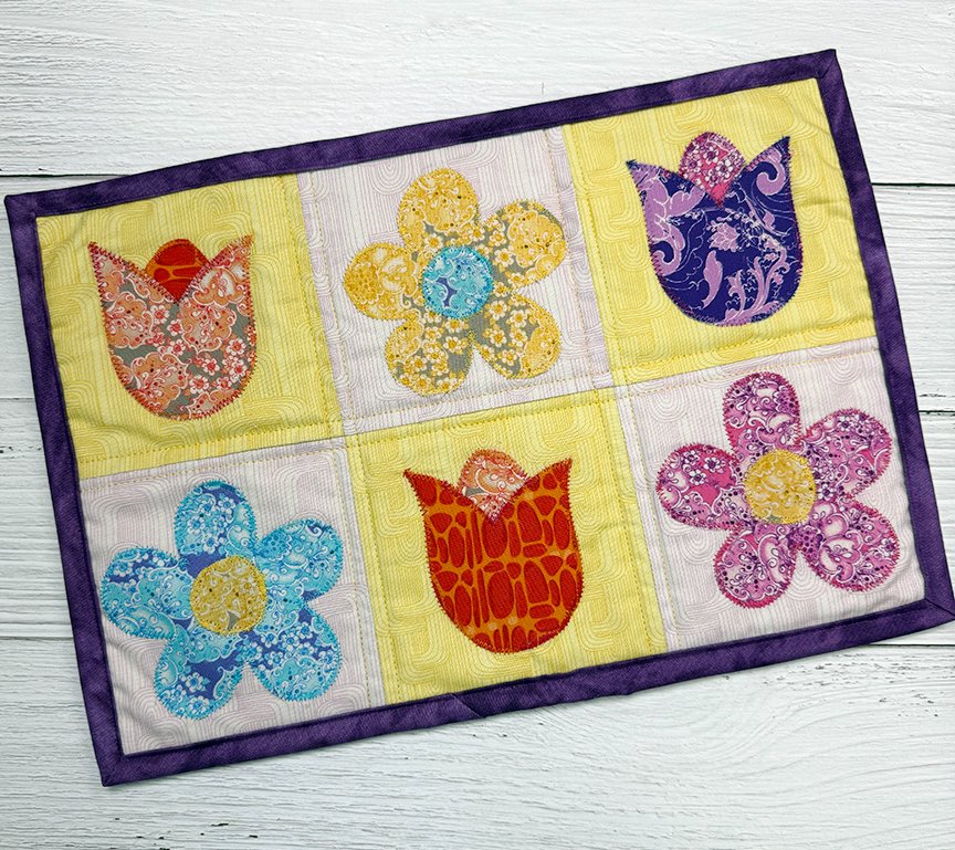 Sit_N_Sew's tweet photo. Turn 5” precut squares into a colorful Flower Garden applique mini quilt!

✔ Beginner-friendly
✔ FREE pattern with qualifying purchase
✔ Full tutorial + video included
📖Read the blog:
https://t.co/V05CRvsOoZ
🎥Watch
https://t.co/lXMtbadois

#quilting #applique #quiltpattern https://t.co/5hCpL59GIl