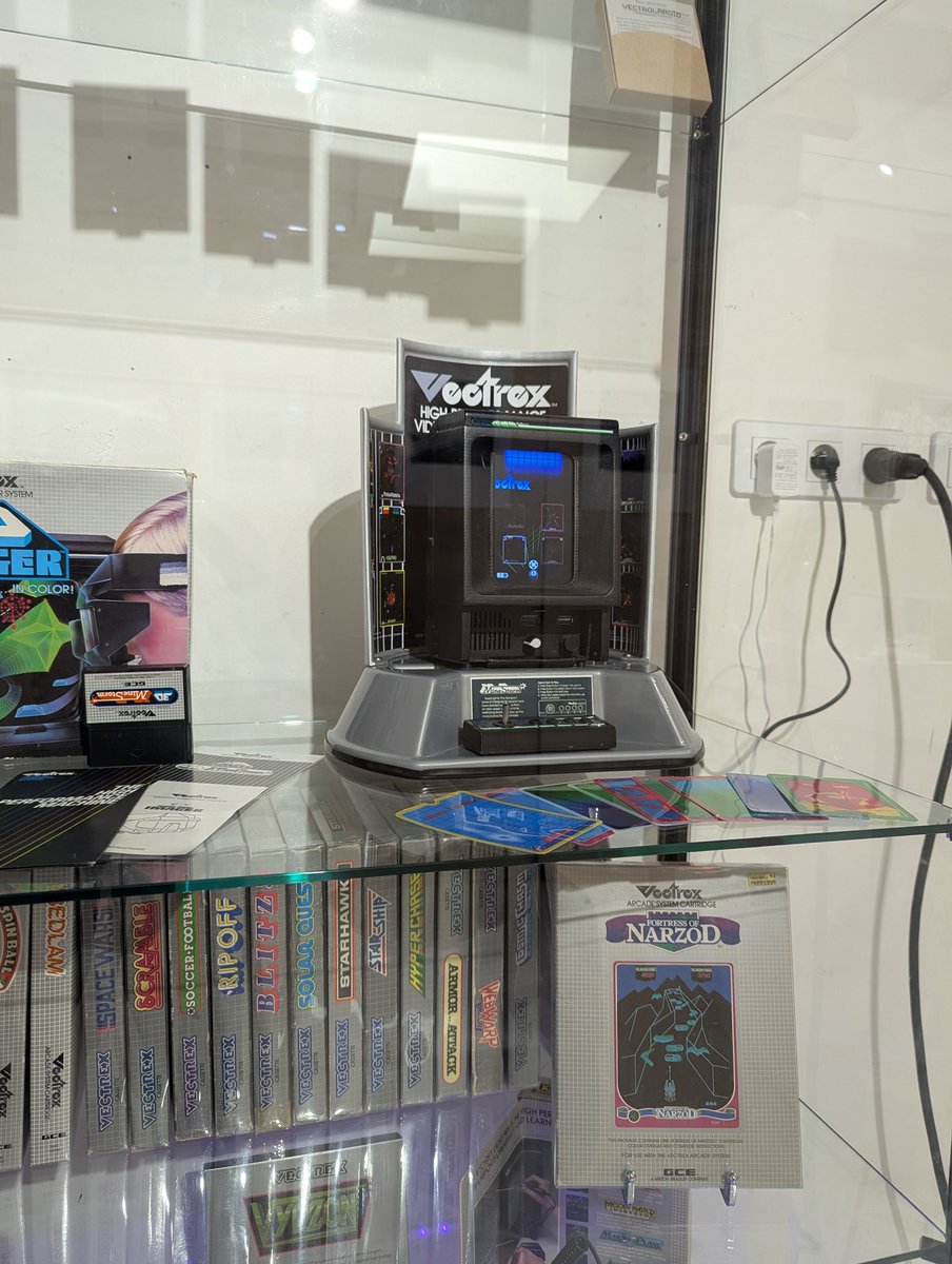 VectrexOn's tweet photo. A Vectrex collection on display. 🕹️✨

Featuring a Vectrex Mini prototype, the 3D Imager, the Light Pen, and a stack of games. https://t.co/DVqN8Or87y