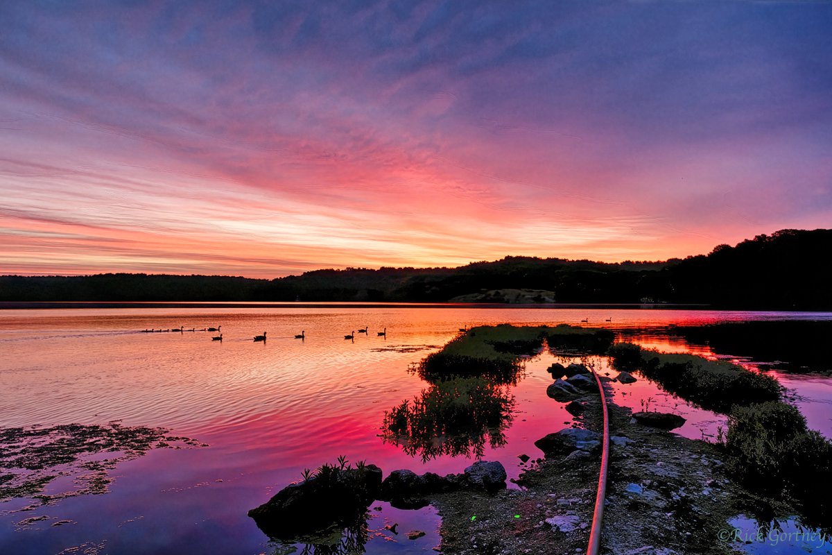 Rgeee's tweet photo. On the jetty out at Lake Jacomo 12 minutes before sunrise this morning. This section was under water a few days ago but now water is down more to normal levels. How cloudy it was when I looked out my window, I didn't expect this gorgeous sunrise. https://t.co/GwhzAVCn4Q