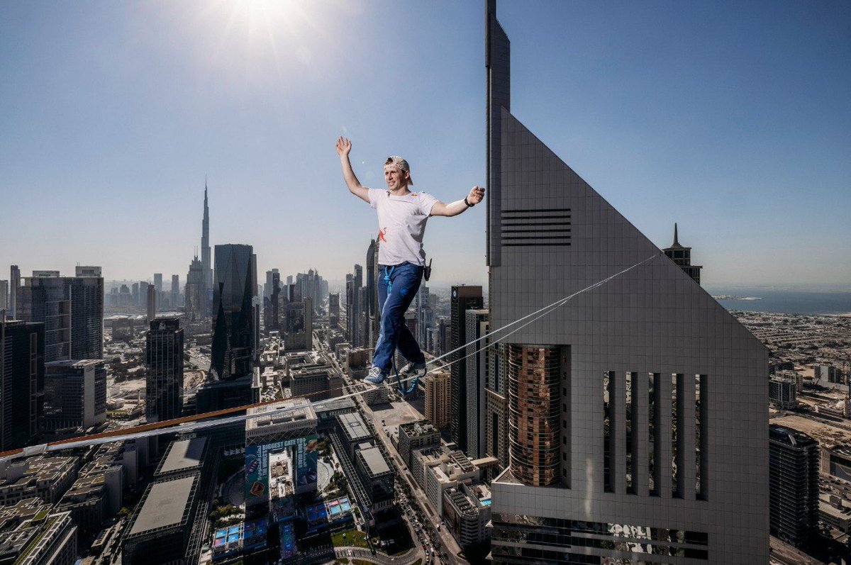 Go2Warsaw's tweet photo. On May 31, world-class slackliner Jaan Roose  will attempt to walk on a line suspended 180 metres above the ground between the two tallest buildings in Poland: the Palace of Culture and Science and Varso Tower. 500 metres apart.
⏰ Time depends on weather conditions. 

More information: https://t.co/BTccBBSaSR

Photo: Red Bull