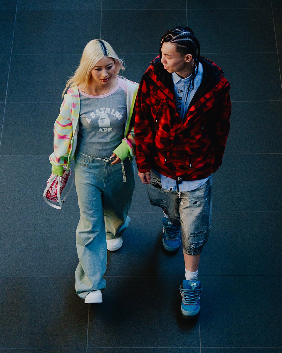 BAPEOFFICIAL's tweet photo. BAPE® 2026 S/S “GOLDEN ERA”

An homage to the golden age of streetwear, reinterpreted through a contemporary Tokyo perspective.

Set between the city streets, vintage Japanese architecture, and rooftop skylines, the collection reflects the enduring dialogue between music, sport, and art.

Featuring Mikado, Yuriko Abad & Pierre Taki

Now available at authorized A BATHING APE® stores and https://t.co/IBXRBlilL2.

#bape #abathingape #bapecamo