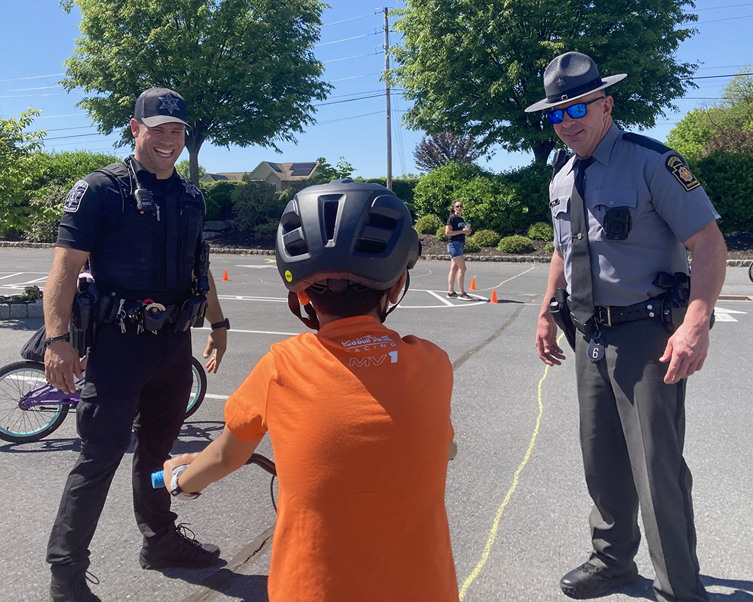 PAStatePolice's tweet photo. Troopers Flail and German joined other local volunteers for the Bicycle Safety Rodeo at Tender Years Child Development Center in Cumberland County. Children performed skill tests, received instruction, and learned rules of the road and safety tips. https://t.co/Wyr5hp6mh6