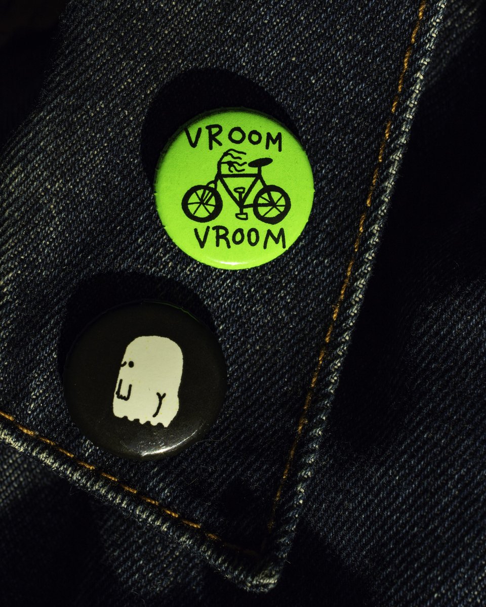 BusyBeaver's tweet photo. These little 1" buttons by Luis Romero are just too fun, and they glow in the dark! Cute by day, spooky by night. 👻🚲 https://t.co/yO4z09xa6z