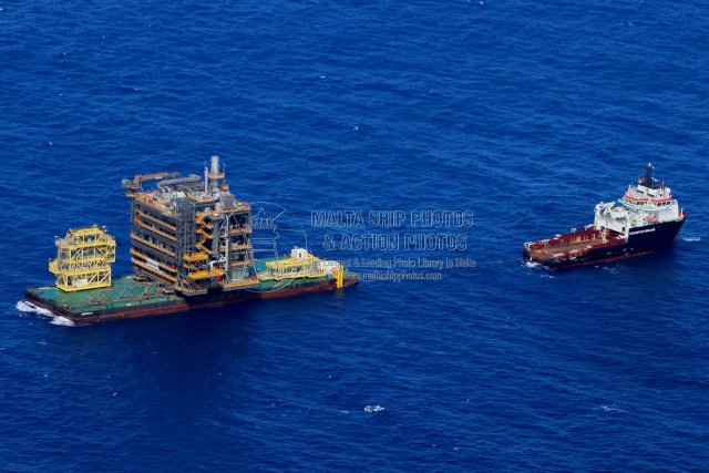 Shipguru's tweet photo. #aerialphotography of the #offshoretugsupplyship #SEA_EVERTSEN #towing #flattopbarge #RANBARGE1 #loaded with #bourifield #gasrecoverymodule #offshoremalta - 14.05.2026 - https://t.co/nfgboxc3g3 - NO PHOTOS can be used or manipulated without our permission @worldshipsoc https://t.co/6NDwAW4dxa