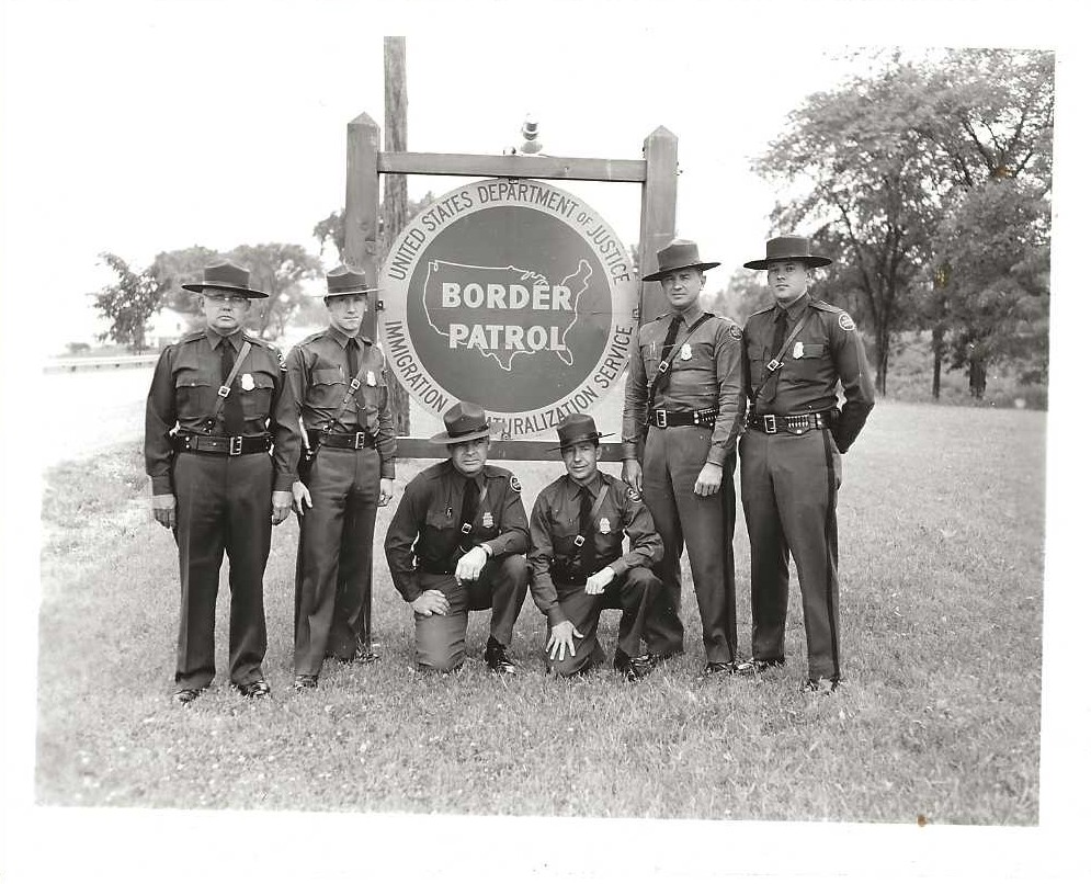 USBPChiefDTM's tweet photo. #TBT #BorderPatrol Inspectors posing next to a station sign in the 1960s. DYK that the current Class A dress uniform for agents was the only uniform until 1934? A standardized version of the rough-duty uniform wasn't authorized until the early 1950s. https://t.co/iiQXuIfqDy