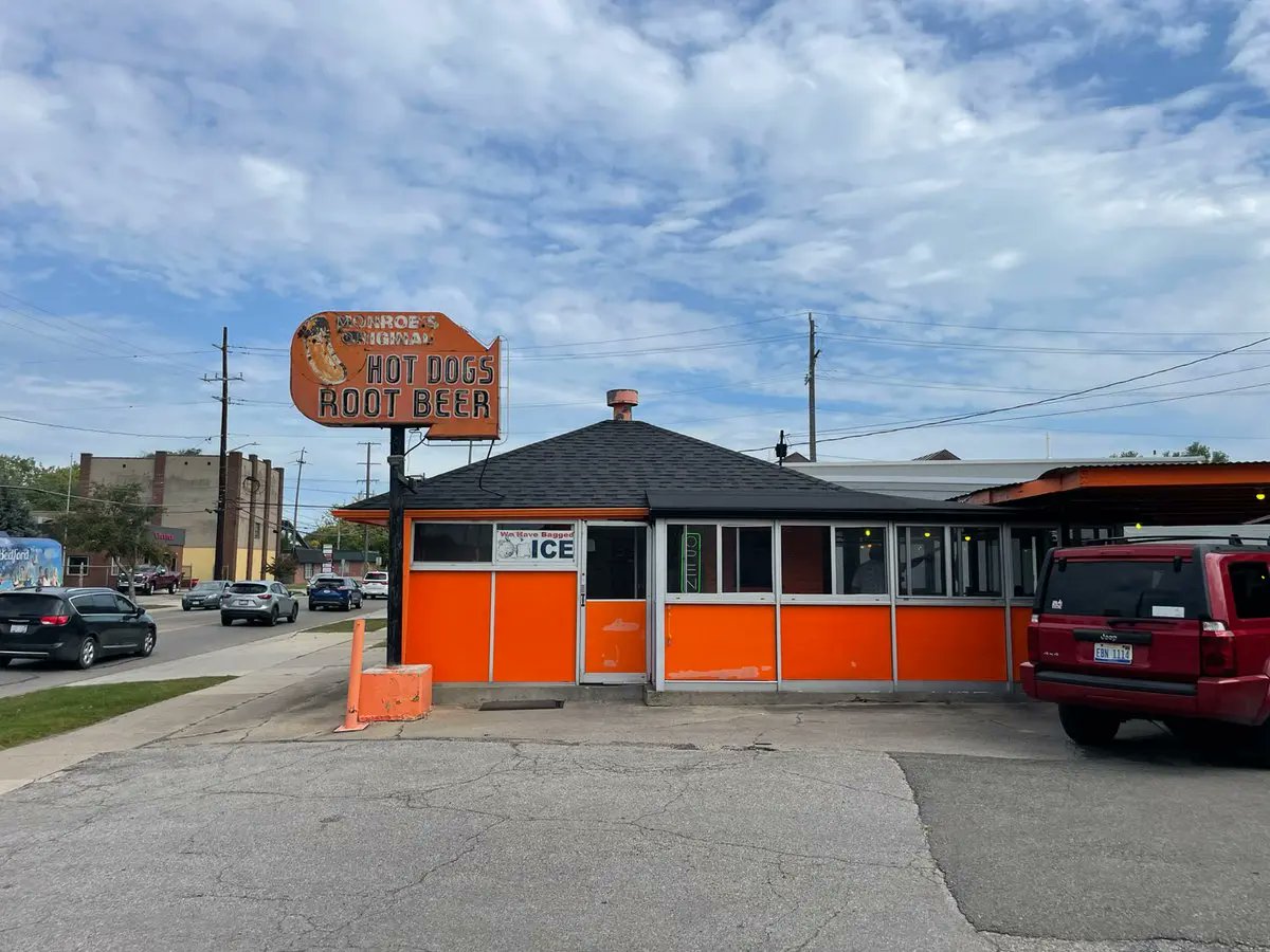 mich_enjoyer's tweet photo. Both Vince’s and Monroe’s Original drive-ins offer similar Monroe-style chili dogs, each differing in taste, but not presentation. The aroma of the chili wafts through your windows as you drive along the River Raisin past Vince’s. After crossing the river and turning onto Front Street, you’ll see the classic orange overhang of Monroe’s Original Hot Dog. And of course, you’ll smell that chili. @noahdwing