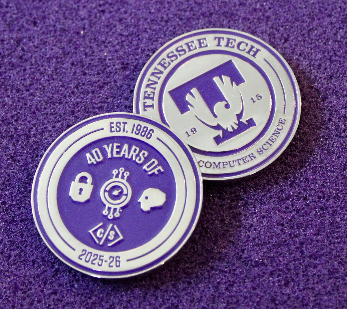 tntechcsc's tweet photo. For the third year in a row, TN Tech Computer Science earned a TCPRA communication award: third place for our custom challenge coin, celebrating grads, mentorship and 40 years of the CS department (Est. 1986). Read about Tech's other TCPRA awards: https://t.co/XffPGKwA23 https://t.co/42GKHNpAsm